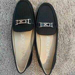 NWT Calvin Klein Lacy Flats – Black with Gold CK Logo | Size 9M
